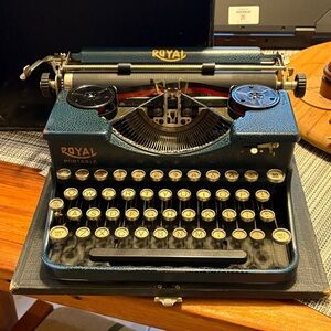 Royal Portable Blue and Black Typewriter with carrying case